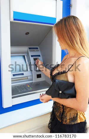 Girl and a cash dispenser
