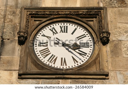 Ornamental clock with Roman numerals on Prague City Hall