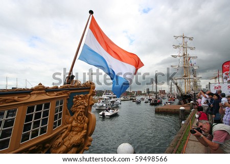 AMSTERDAM, AUGUST 19, 2010: Dutch flag on historic sailing ship at Sail 2010 in Amsterdam, Holland on august 19, 2010
