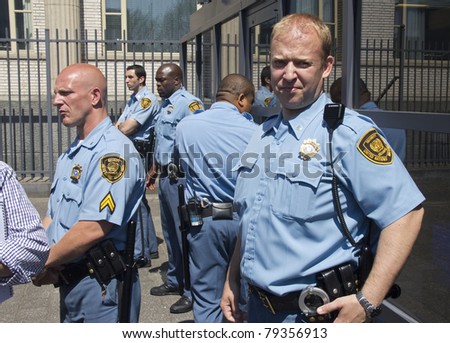 THE HAGUE, HOLLAND - JUNE 3: Unidentified UN security guards at the gate of the Yugoslavia Tribunal on June 3, 2011 in The Hague, Holland. Serbian ex-general Mladic is on trial for war crimes here.