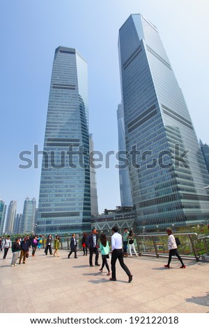 SHANGHAI, CHINA - APRIL 14, 2014: People on Shanghai Lujiazui flyover and buildings of Pudong New Area