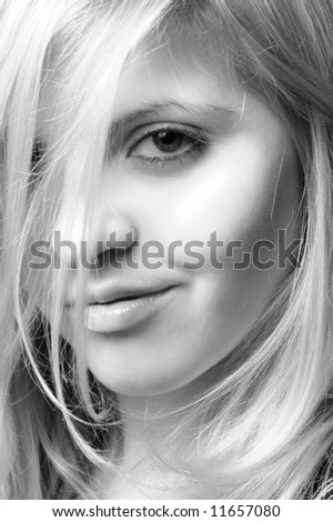 Face of pretty young woman close-up black and white image