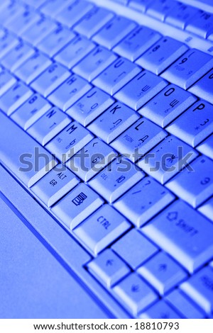 Keyboard of laptop close-up, may be used as background
