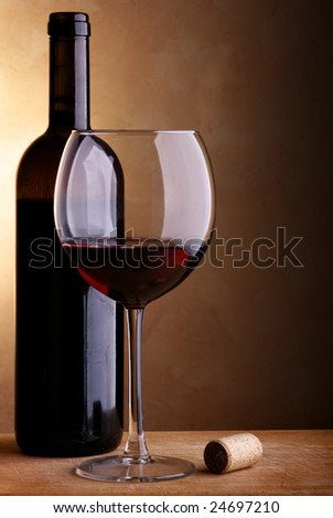 Still-life with wine bottle of red wine and glass
