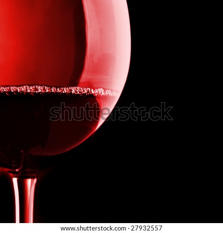 Glass of red wine over black  background