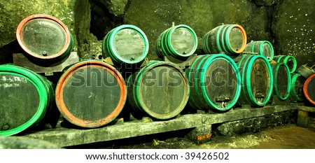 Wine barrels in cave in a row