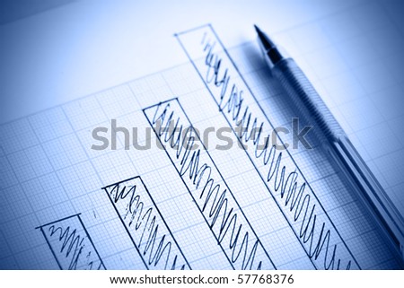 Pen and profit bar chart. Shallow DOF!