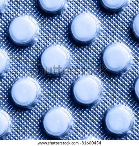 Pills pack close-up toned in blue color