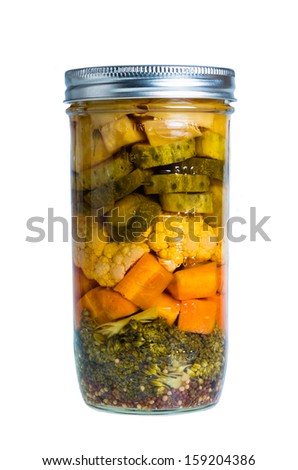 Mixed pickled vegetables preserved in mason jars home canning