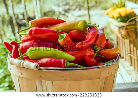 Hot banana peppers in a wooden basket