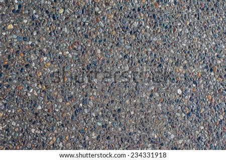 A pebbled or rough finished concrete surface for use as a texture