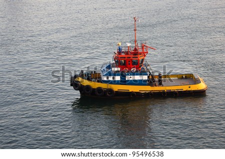 A tug boat waiting to assist ships in the harbor