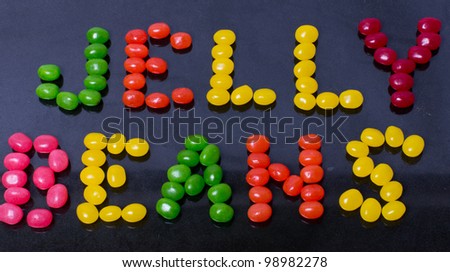 A Jelly Beans sign on black in jelly beans front angle