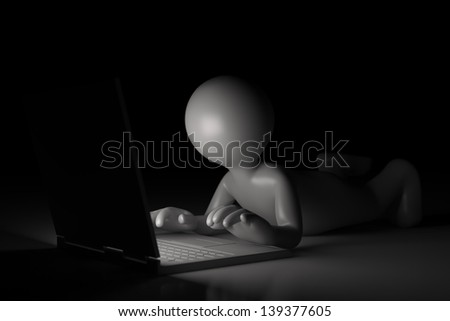 Little man at the computer - Isolated on dark background