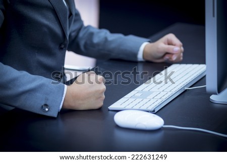 Business woman stops from typing on the computer and slams his fist on the table