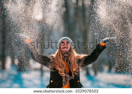 Similar – Image, Stock Photo Woman throwing snow in snowy landscape in winter.