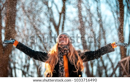 Similar – Image, Stock Photo Woman throwing snow in snowy landscape in winter.