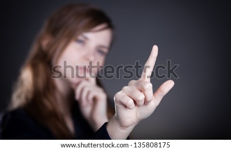 Woman\'s hand and one finger pointing something