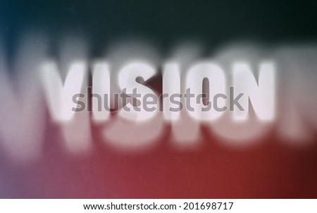 Vision word on vintage blurred background, concept sign