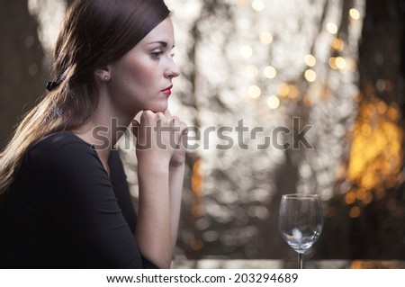 Lonely unhappy woman in restaurant waiting for date