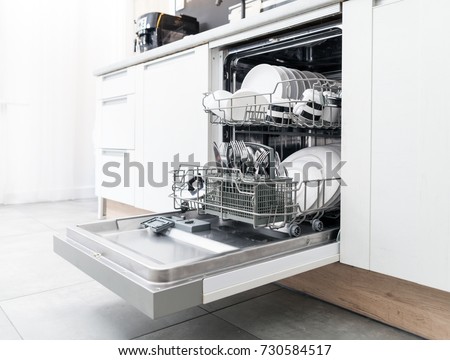 Open dishwasher with clean dishes in the white kitchen 商業照片 © 