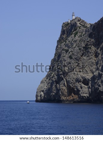 Boat by the lighthouse of Cape Formentor, Majorca, Spain.