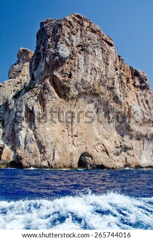Cliffs ocean and boat foam in Mallorca, Balearic islands, Spain.
