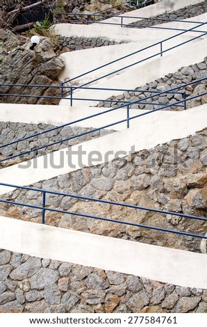 PORT DE SOLLER, MALLORCA, SPAIN - APRIL 22, 2015: Zigzag pattern on staircase seen from the side with drystone wall on April 22, 2015 in Port de Soller, Mallorca, Balearic islands, Spain.