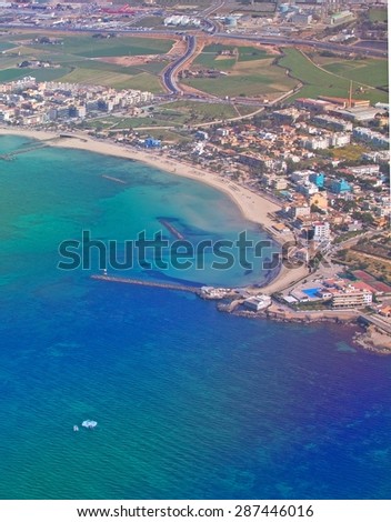 PALMA, MALLORCA, SPAIN - APRIL 24, 2015: Aerial view of turquoise ocean and sandy beaches east of Palma near Portixol  as the plane takes off on April 24, 2015 in Palma de Mallorca, Spain.