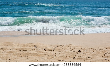 Green wave whith white seafoam closeup on sandy paradise beach, Sri Lanka, Asia.