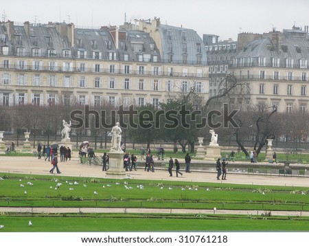 PARIS, FRANCE - DECEMBER 31 2009: Sculpture park in central Paris with green grass and people on December 31 2009 in Paris, France.