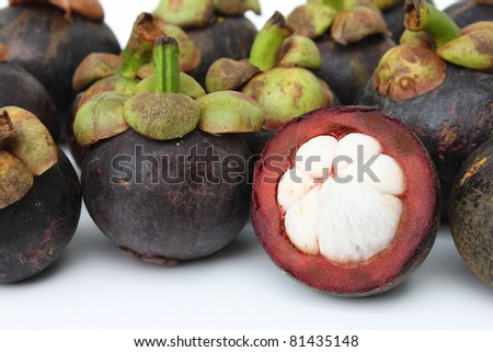 isolate mangosteen on white background, the tropical purple fruit in Thailand.