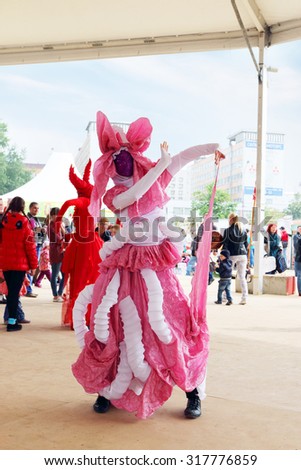 PERM, RUSSIA - JUN 15, 2014: Dancer in costume poses on street theaters show at open air festival White Nights