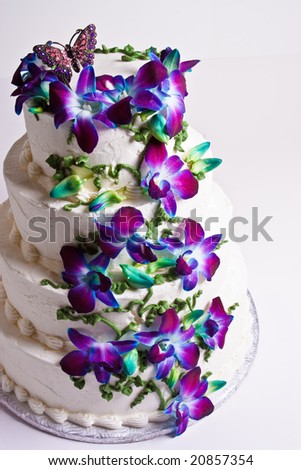 Four tier wedding cake with purple flowers