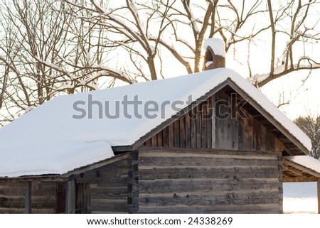 Fresh snow covering a cabin roof