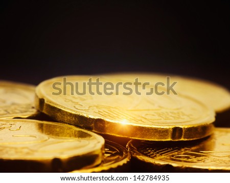 Gold coins macro on black