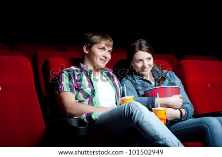 http://image.shutterstock.com/display_pic_with_logo/787933/101502949/stock-photo-couple-in-a-movie-theater-watching-a-movie-101502949.jpg