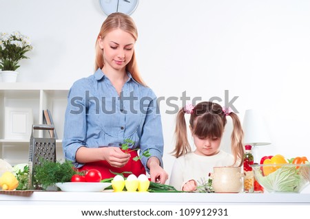 Mother and daughter cooking together, help children to parents
