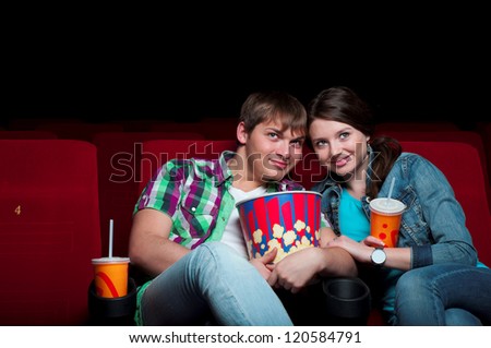 couple in a movie theater, watching a movie
