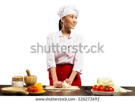 Asian female chef cooking pizza dough, isolated on white background