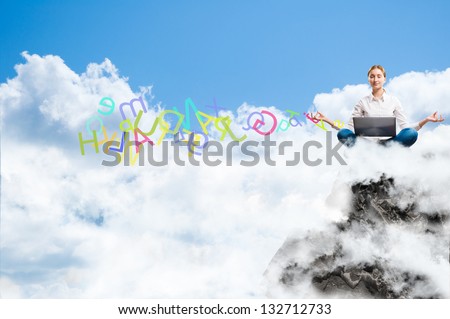 young woman meditating with a laptop on a rock in the clouds, from the laptop crashes color alphabet