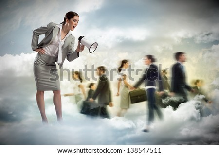 woman shouting into a megaphone at the crowd of business people, the concept of aggression
