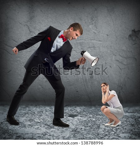 man screams at the frightened woman, the concept of aggression