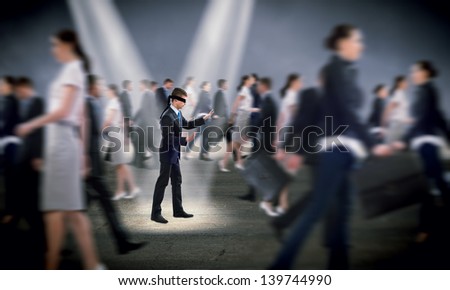 young blindfolded man. his arms and looking for a way out