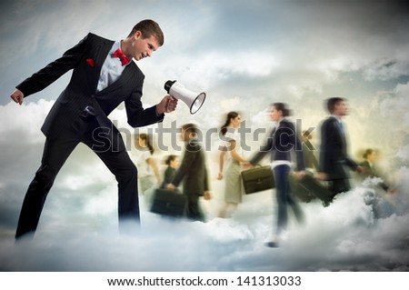 man shouting into a megaphone at the crowd of business people, the concept of aggression