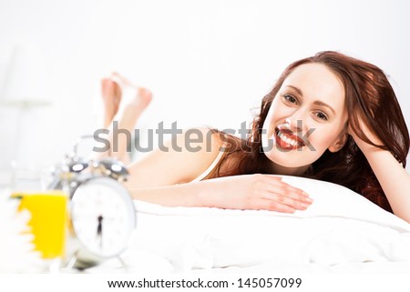 portrait of a young woman lying in the bedroom and rest