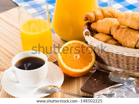 continental breakfast: coffee, orange, croissant and juice