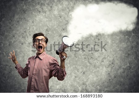 man shouts through a megaphone. from the megaphone off steam