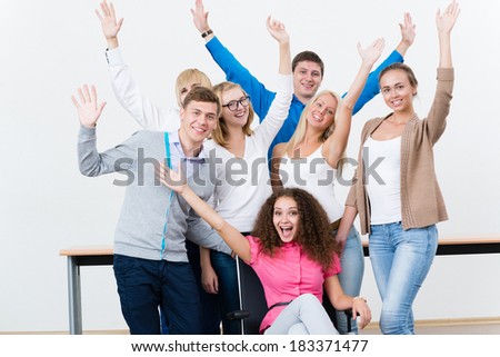 University students in the class raised their hands and having fun