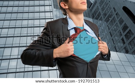 businessman tearing his shirt under her blue clothes super hero